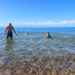 Swimming in Issyk Kul on the Kyrgyzstan adventure