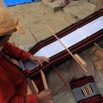 A Naga lady weaving a shawl