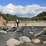 Crossing the Noa Dihing river on the Namdapha trek